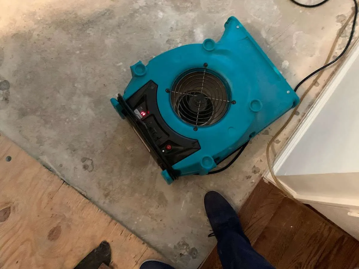 Air mover drying subfloor during Leak Detection & Repair in Harrisburg